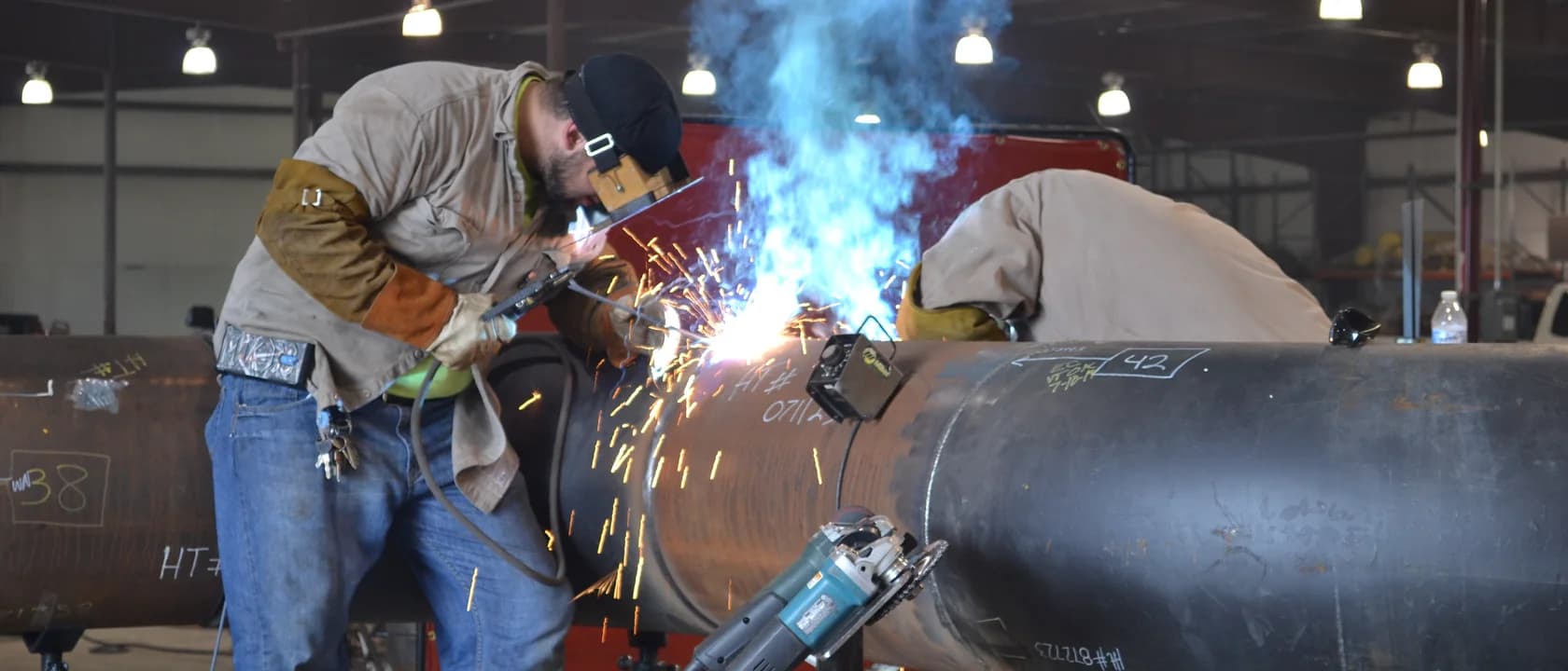 ShalePro welders joining large-diameter pipe in the fabrication shop