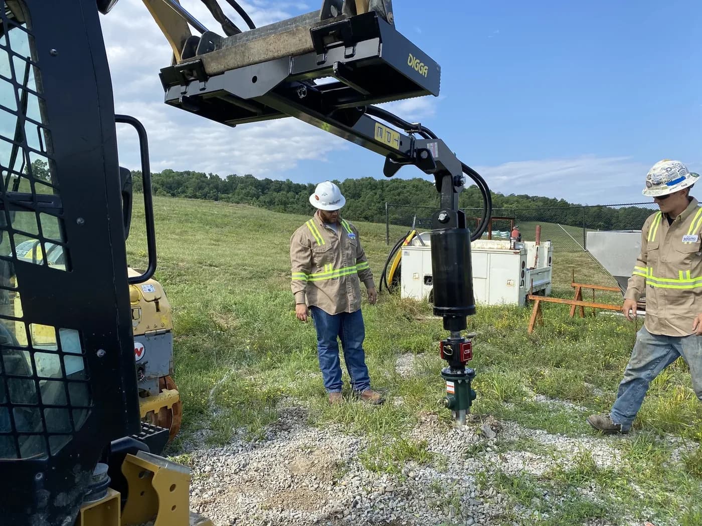 ShalePro crew driving a helical pile with a skid steer drive head